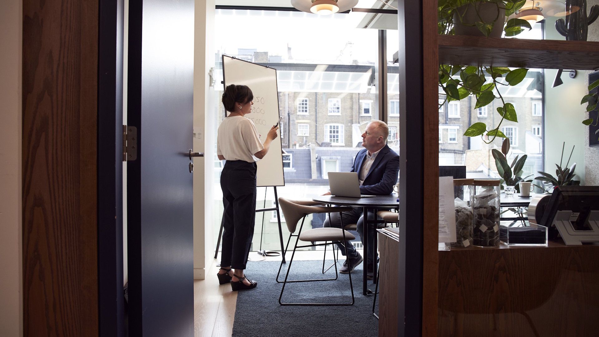 Female consultant performing a training to an employee