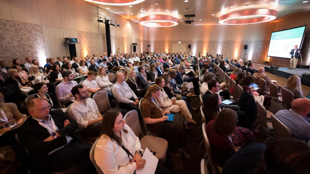 Photo of the full room and the rows of attendees during a session of the E-Invoicing Exchange Summit 2025 in Vienna