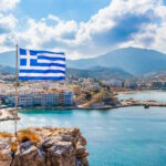 Panoramic view of Pagadia Bay and Harbor, with the Greek flag at the front