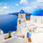 Photo of the scenic view, white walls and blue roofs of Santorini, an Island in Greece