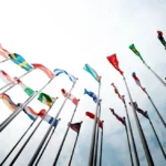 Set of flags from around the world waving in the wind