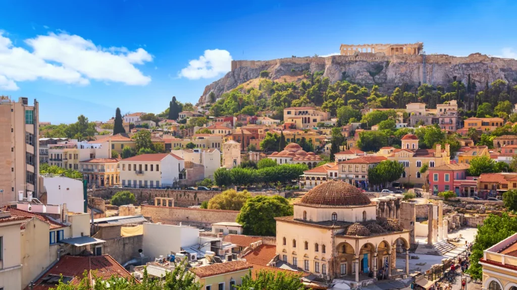 Skyline with Monastiraki Square and the Acropolis hill at sunset, in Athens, capital of Greece.