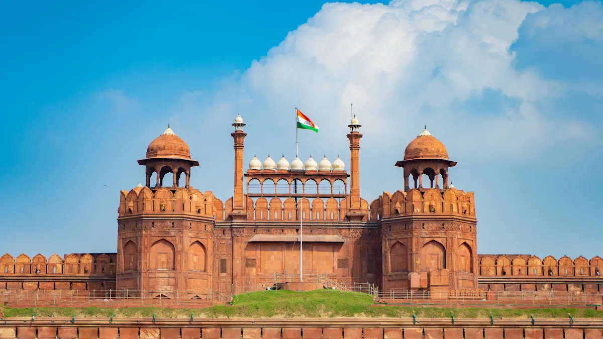 Red Fort (Lal Qila) in New Delhi, India, with the Indian flag flying above its historic red sandstone walls.