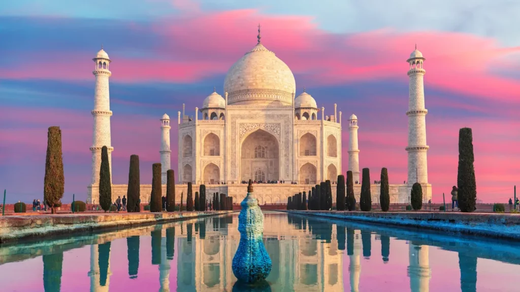 Photo of the Taj Mahal in India, over a pink sky