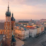 Aerial view of Kraków’s Old Town and Main Market Square in the morning sun, with St. Mary’s Basilica and the Cloth Hall, Poland.