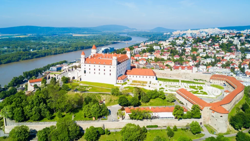 Panoramic aerial view of Bratislava, with its iconic castle overlooking the city.